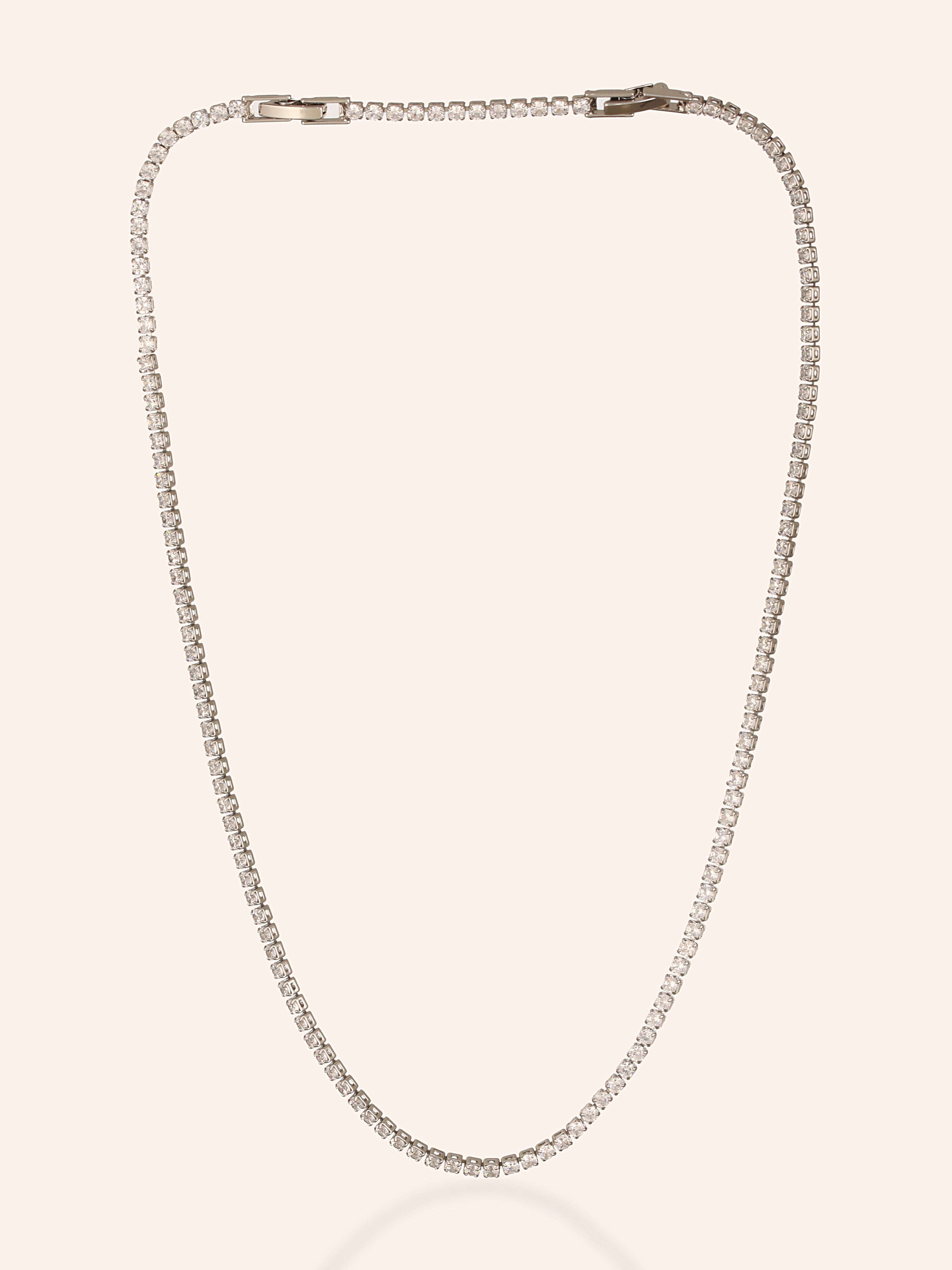 In the image, Zelci’s Midnight Luxe Necklace has been displayed in white backdrop