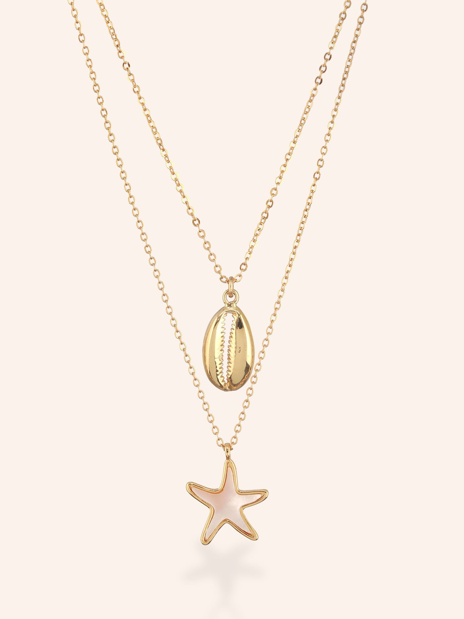 Seashell and star charm of Mermaid Layer Necklace has been highlighted in the image