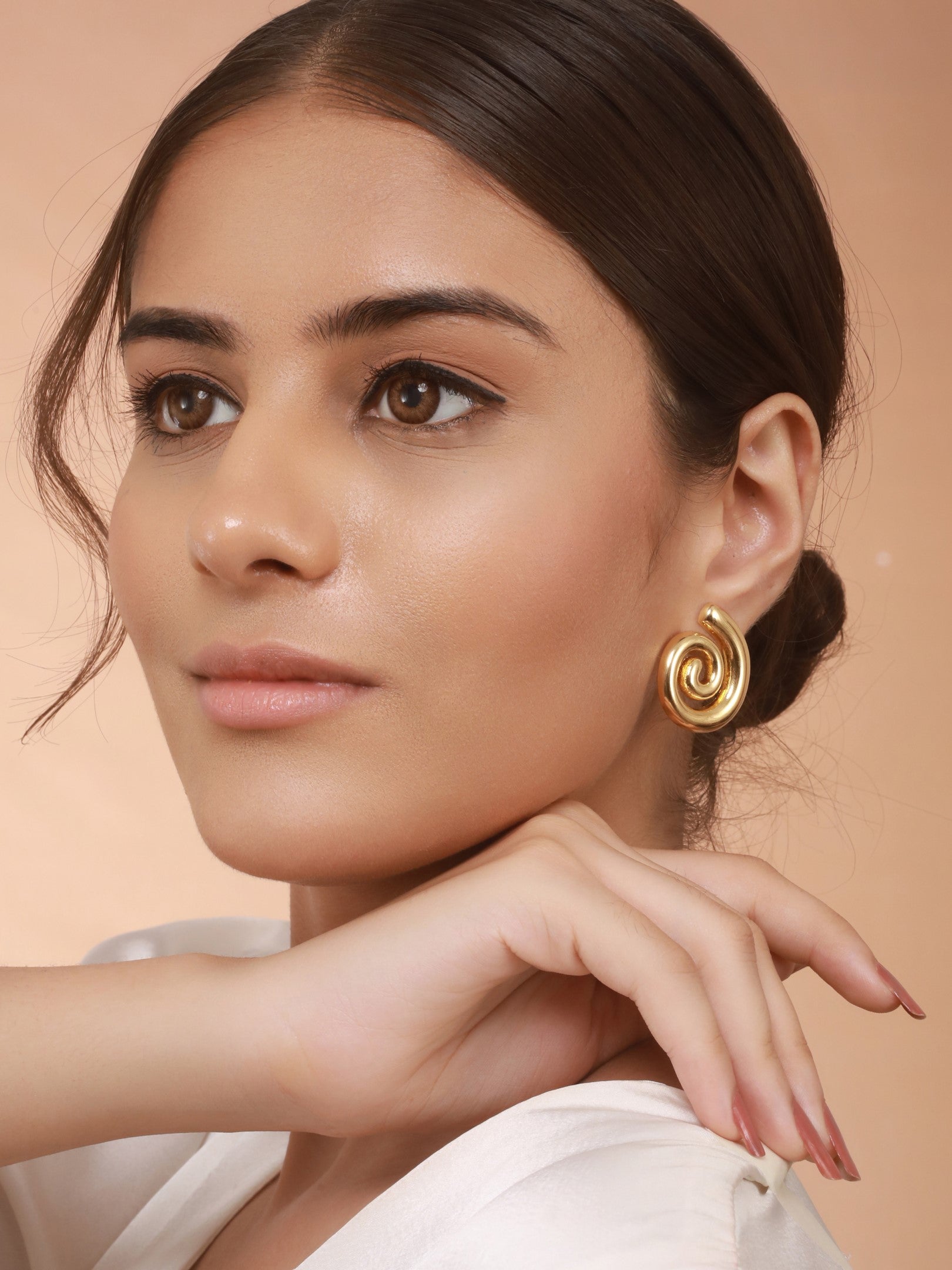 The Swirl Studs of Zelci has been styled on model