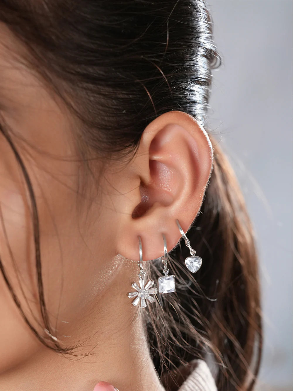 The model is flaunting The Floral Sparkle Trio of Zelci