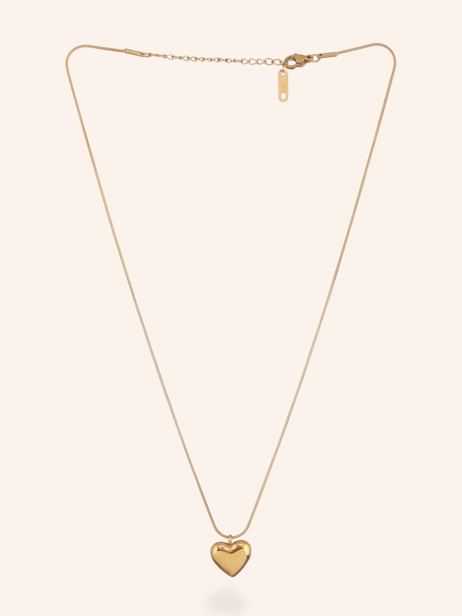 Zelci's Heart Pendant Necklace in white background is displayed