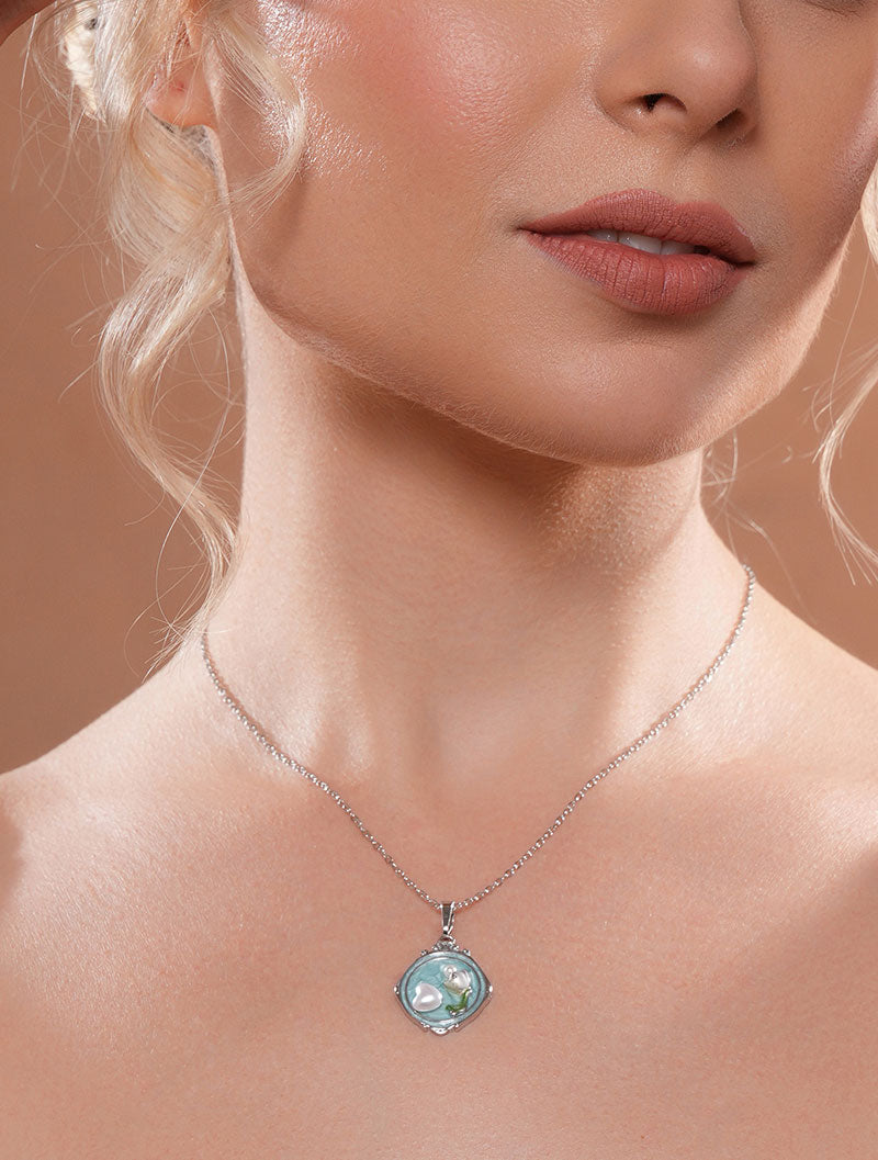 Zelci's Cameo Pendant glistens gracefully on the model's neck