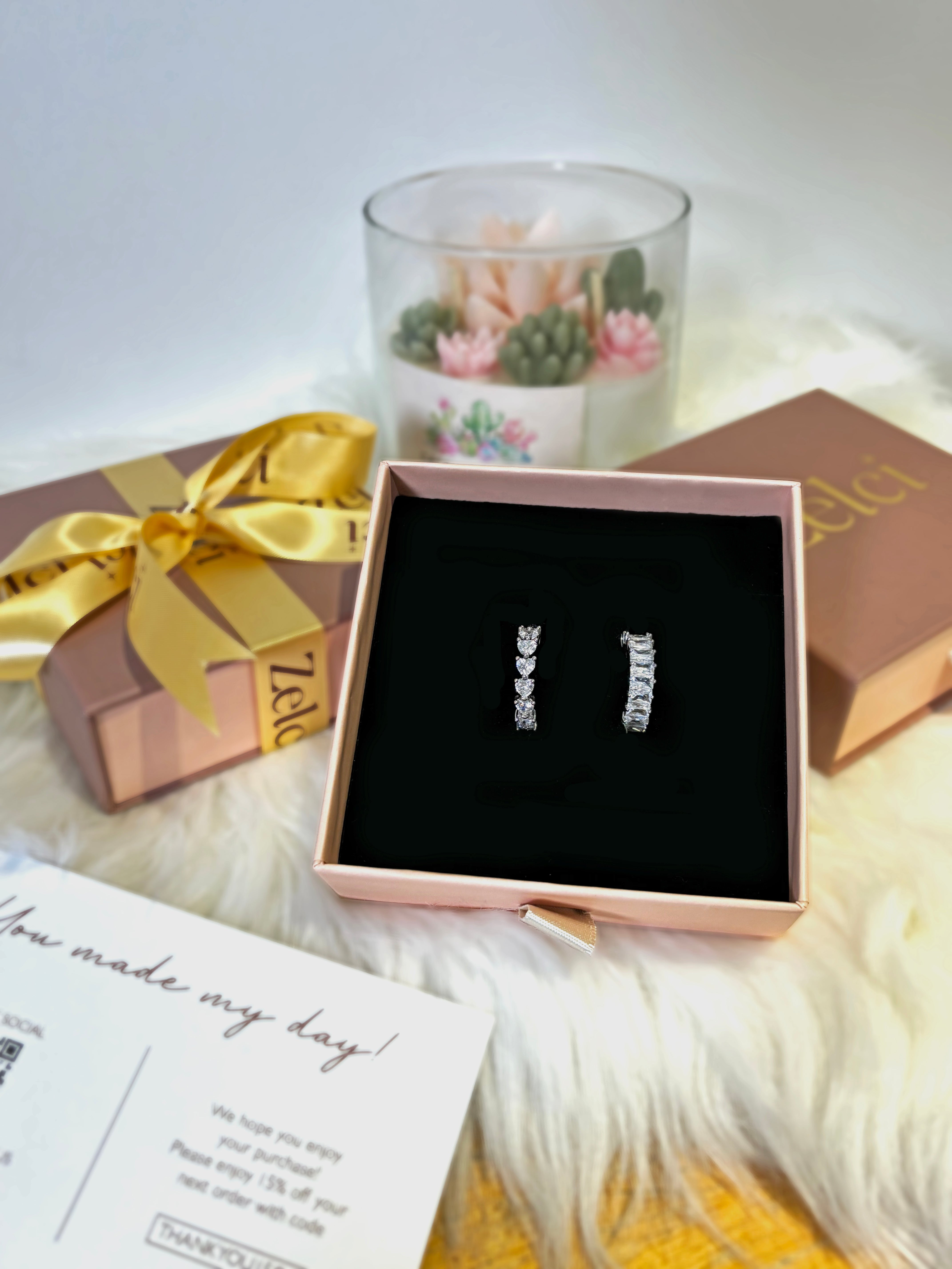 Eternal Shine Ring Duo of Zelci in a decorative box is placed in the picture