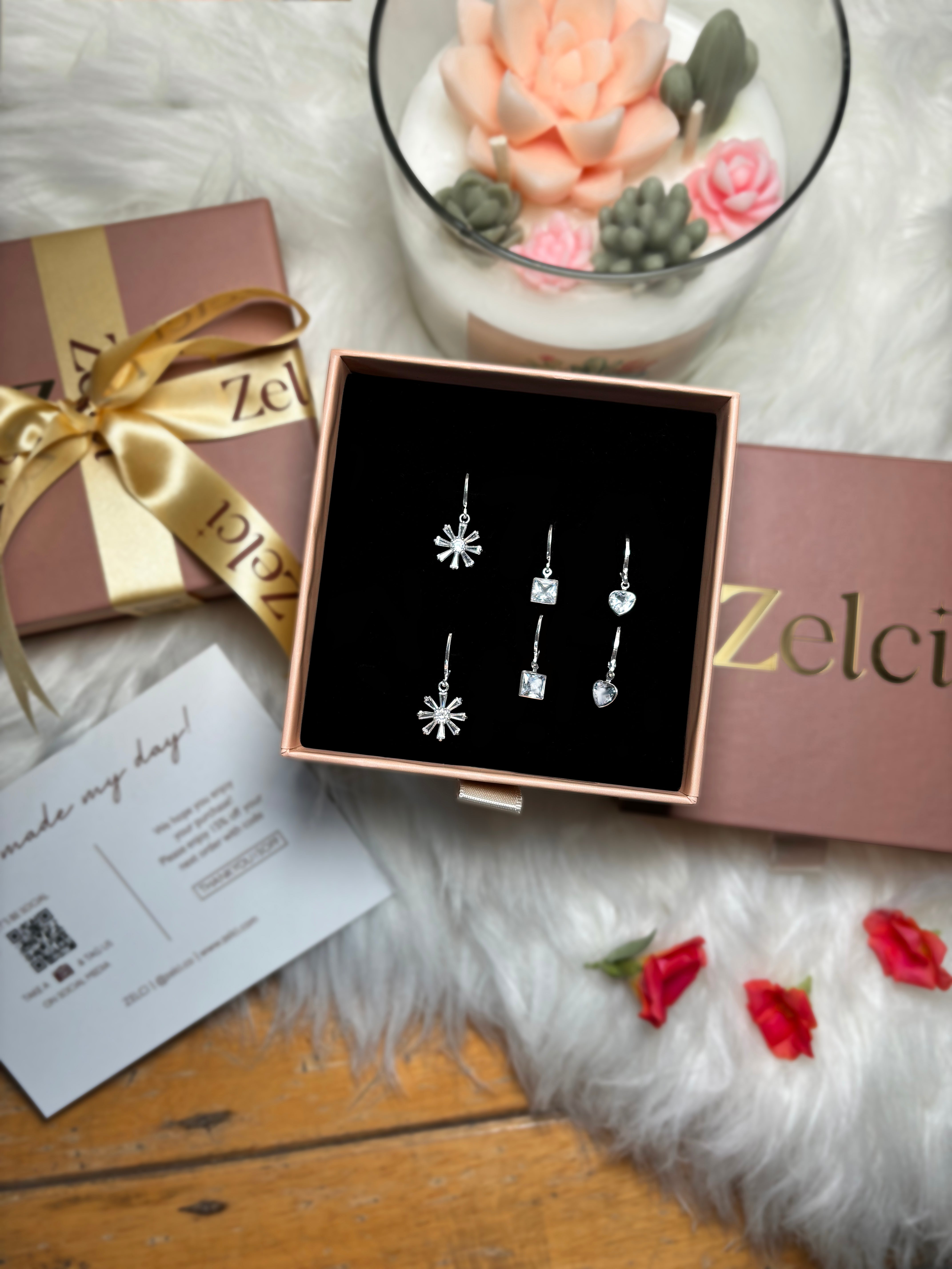 The picture captures the Floral Sparkle Trio of Zelci inside a stylish box
