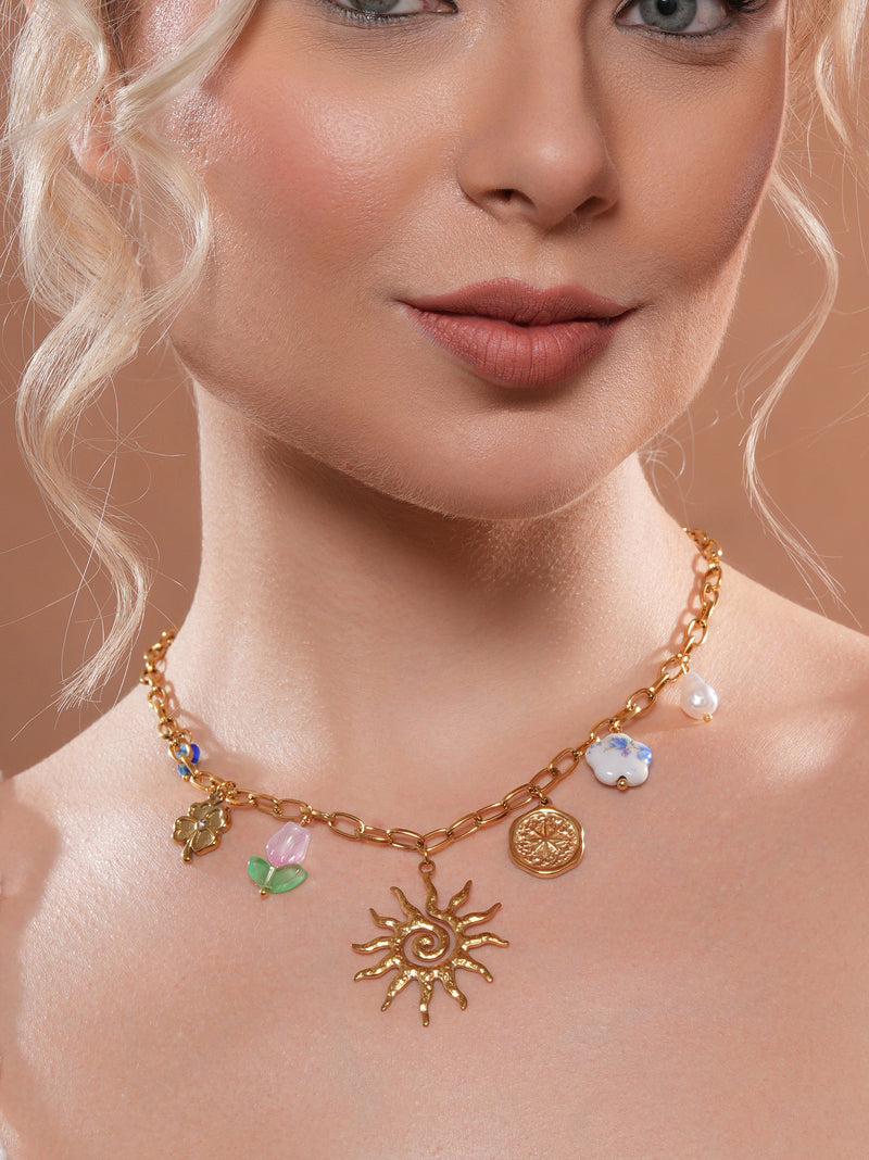 Zelci's Solara Charm Chain is dazzling on the model's neck
