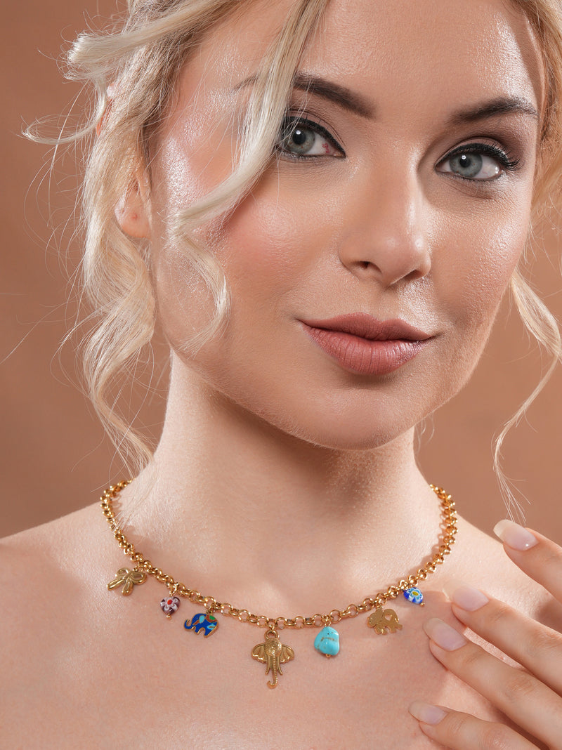 The model is posing with Zelci’s Elephant Charm Chain