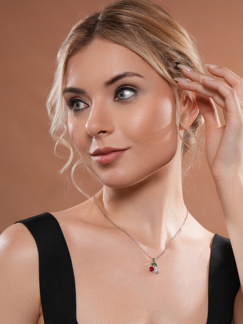 The model is looking to the side, wearing the Cherry Spark Pendant