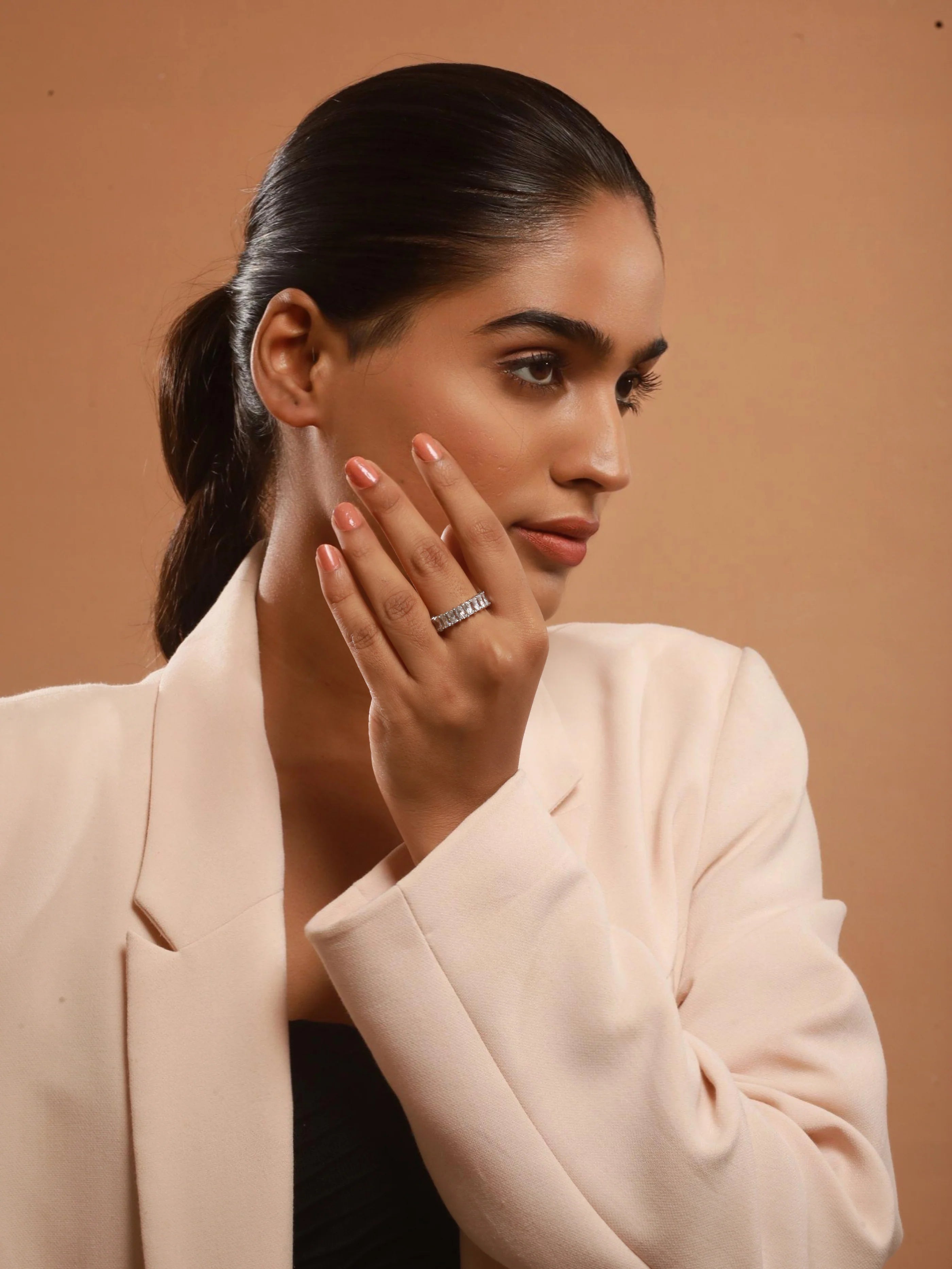 The model is posing with The Eternal Shine Ring Duo of Zelci in her finger