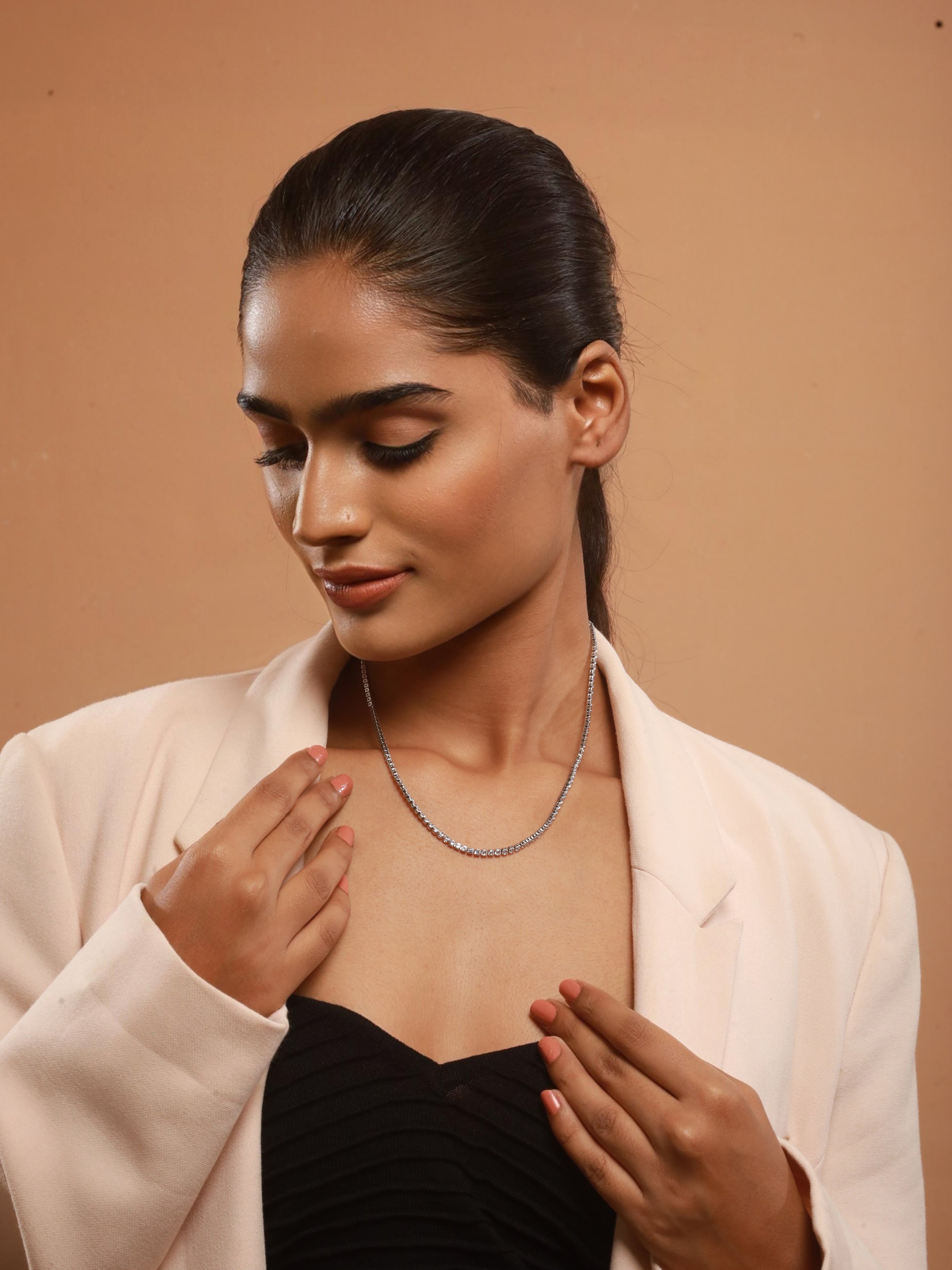 The model exudes style, flaunting Zelci’s Midnight Luxe Necklace