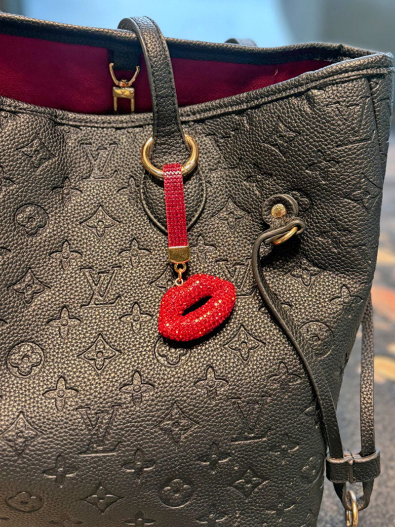 The picture features the zoomed in view of Zelci's Scarlet Kiss Keychain