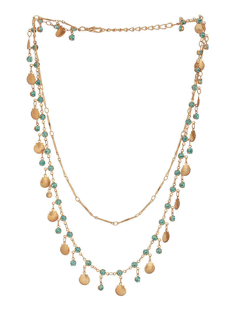 Zelci’s iconic Seaside Layered Necklace shines with sophistication on a simple white display