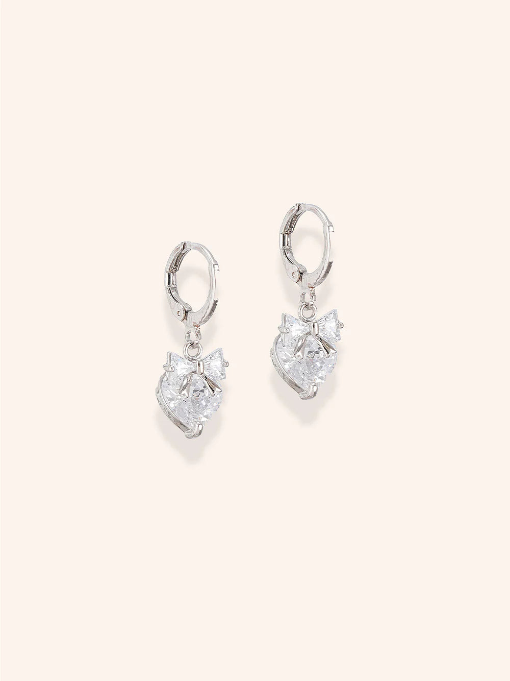 Elegant Dewdrop Darling Earrings of Zelci’s Bowtiful Trio set have been presented on a clean background
