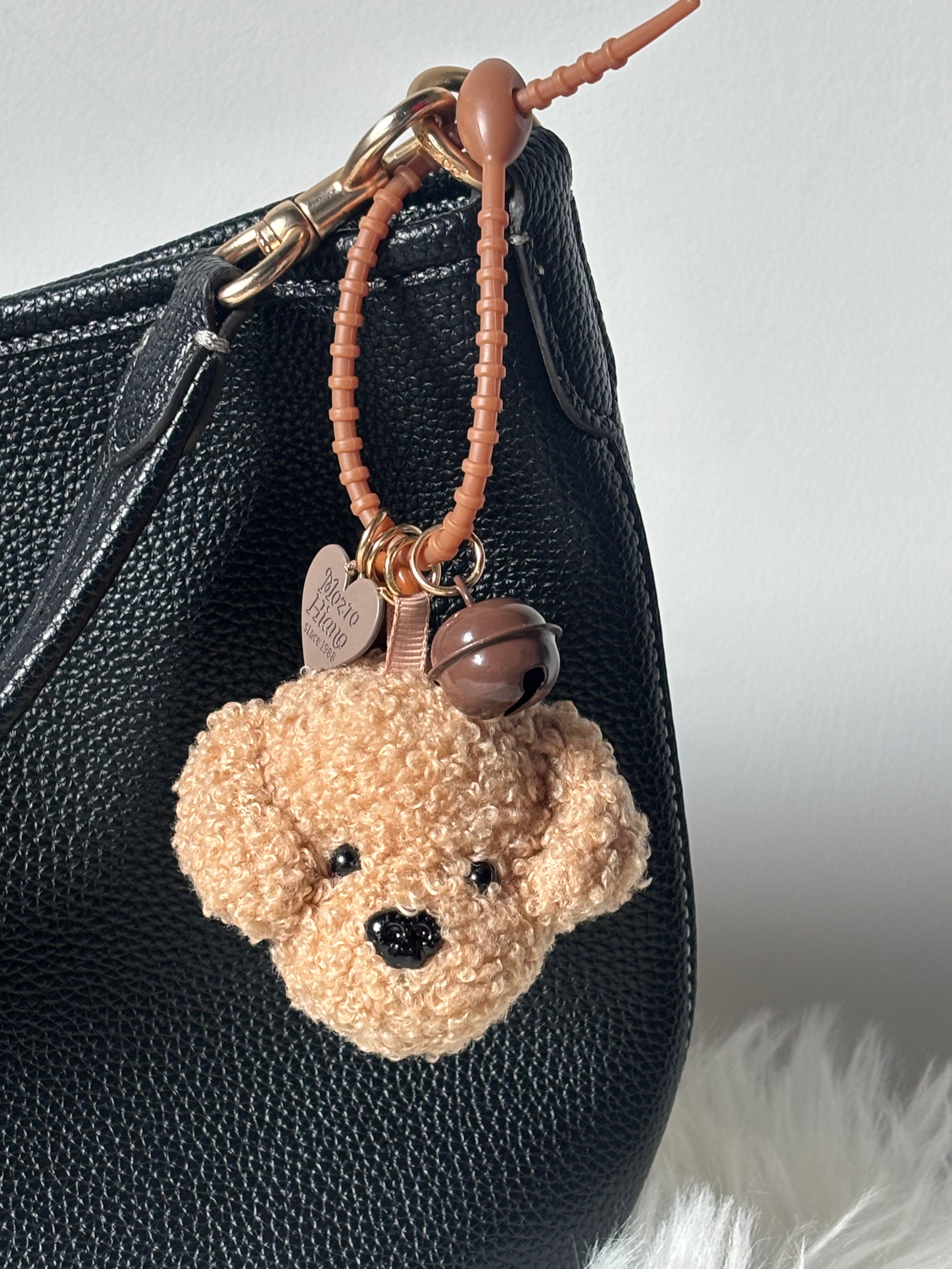 The image features the zoomed in view of Zelci's Plush Keychain