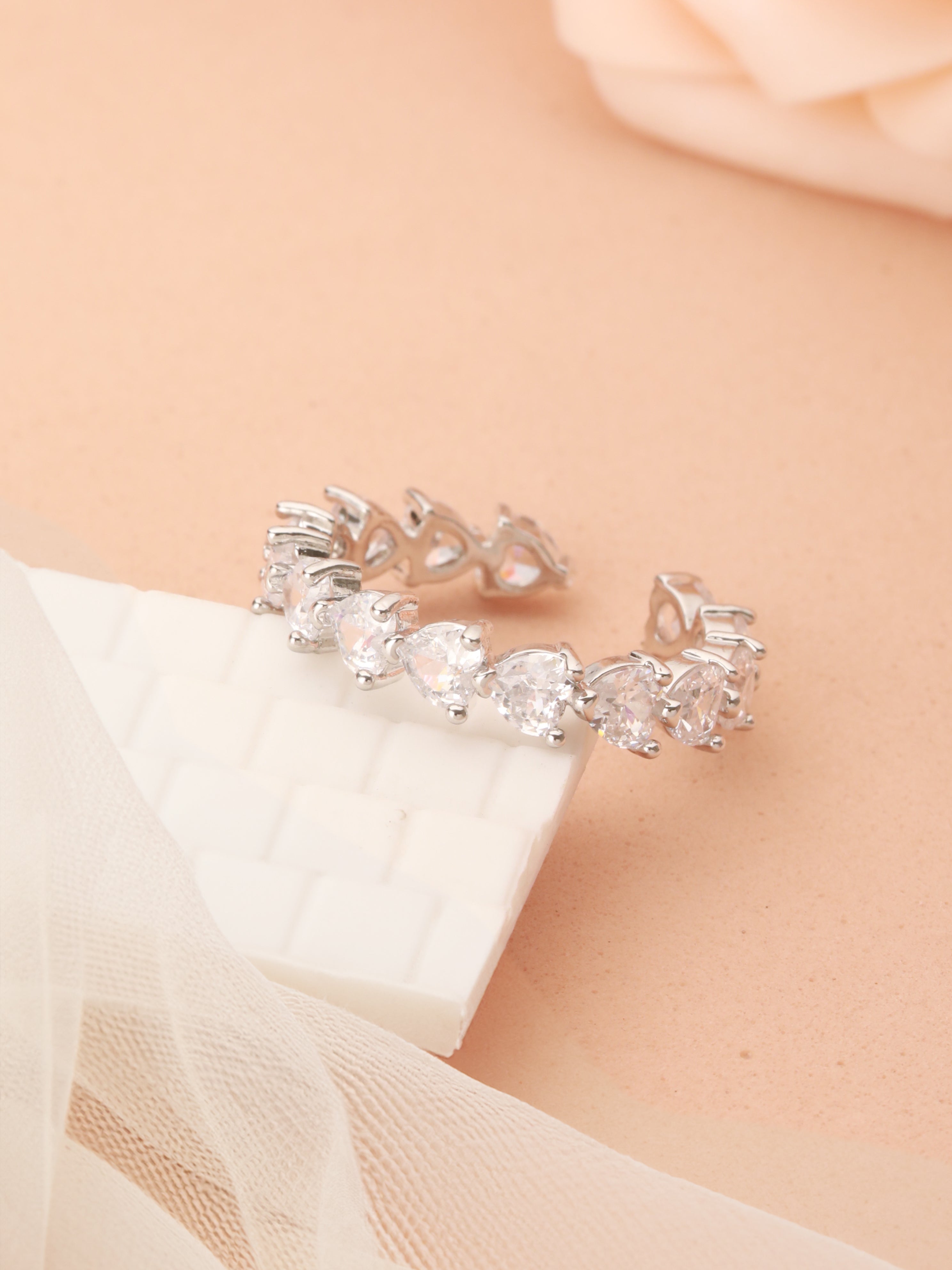 Zelci’s Eternal Shine Ring Duo are captured beautifully on an elegant designed surface
