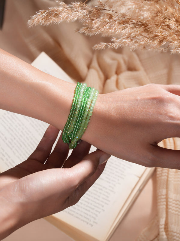 With effortless charm, the model highlights Zelci Lime Luxe Bracelet on her wrist