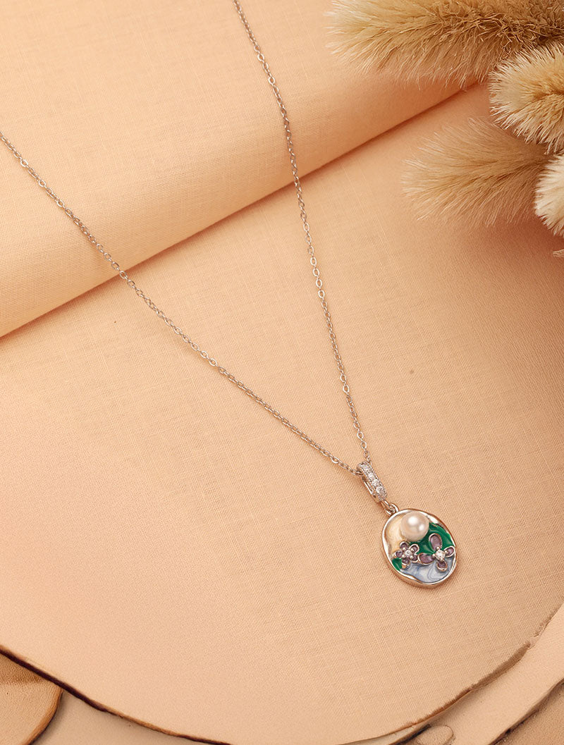 The charm of Zelci’s Pearl Garden Pendant shines brighter on its decorative display