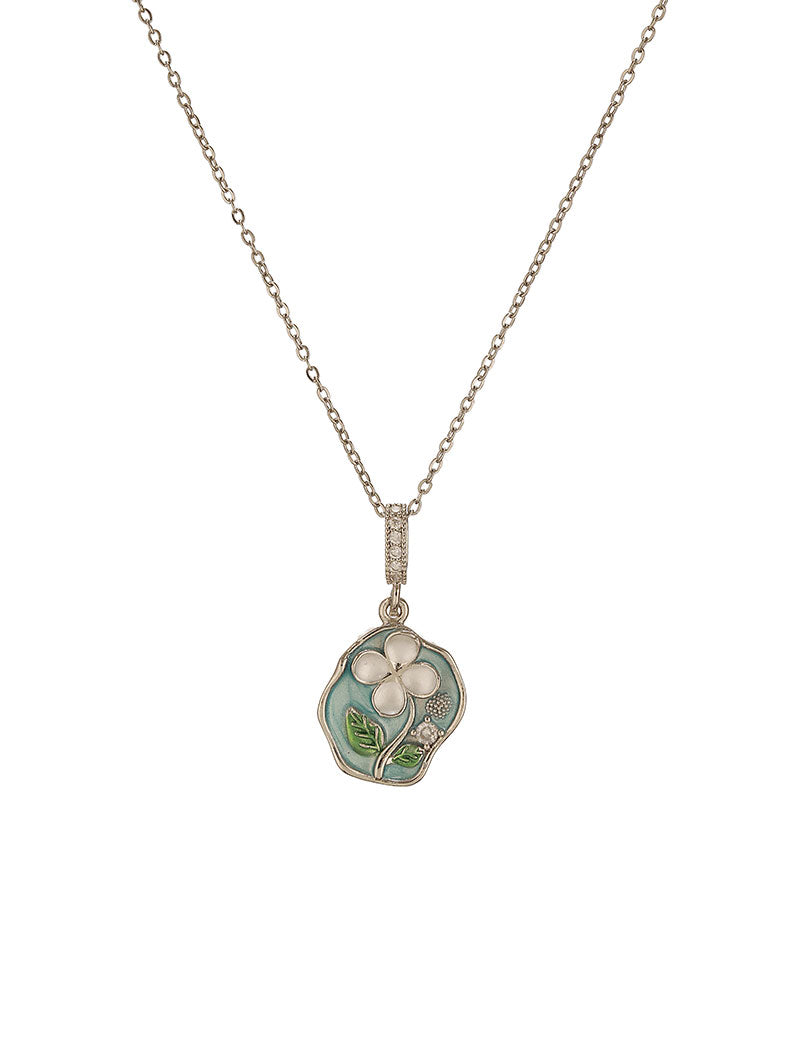 Set against a clean white display, Zelci’s Petaline Pendant radiates timeless charm