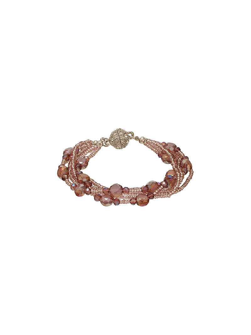 Zelci’s Roselle Bracelet is carefully placed horizontally on a white surface